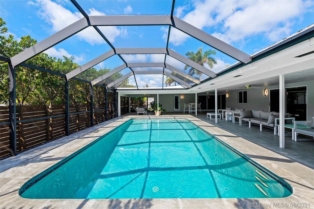 This is a MUST HAVE! Screened in pool area. Perfect for being outside and relaxing by the pool.