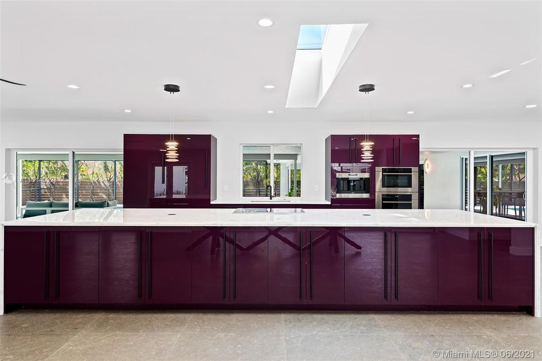 Italian cabinetry that feels Presidential. A rich plum color that is the future of design. The countertop is over 17 feet long and made of Crystallo quartz. Wolf ovens, induction cook top with downdraft ventilation, Sub Zero refrigerator and Asko dishwasher. Plenty of storage for all your cookware and holiday dishware.