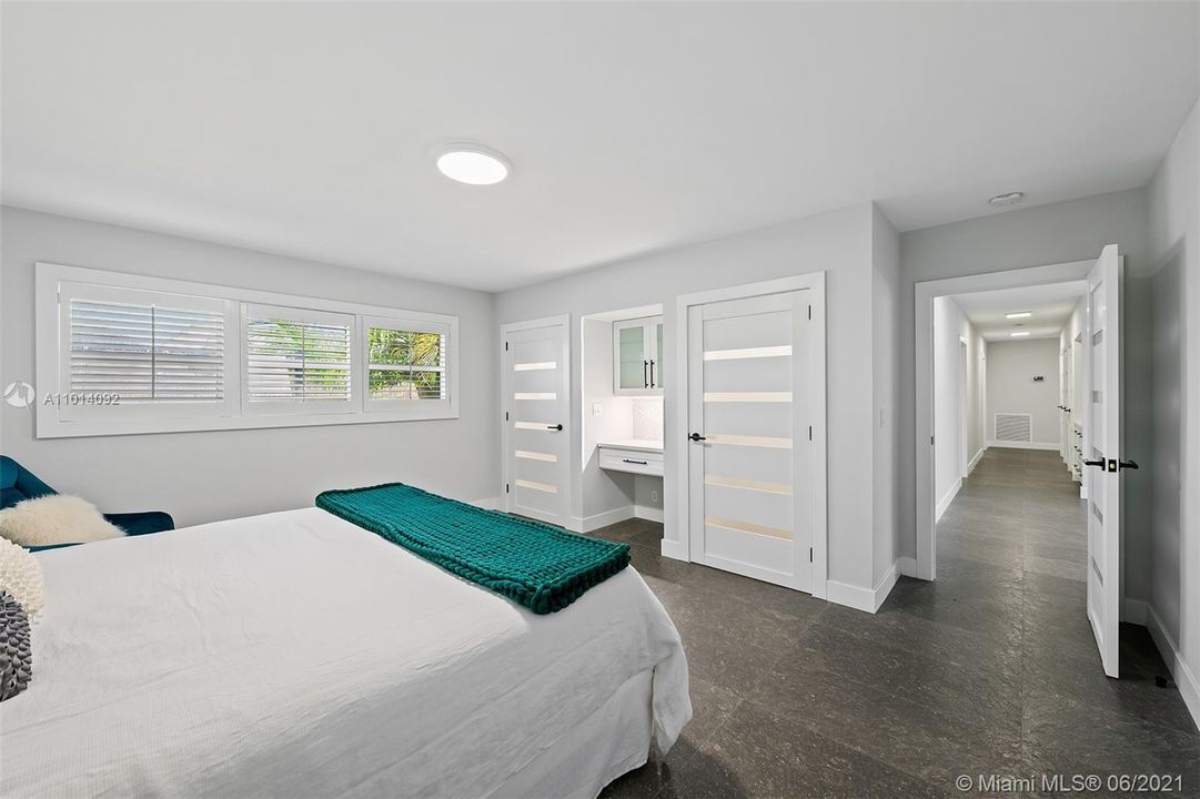 Spacious guest bedroom! Featuring a desk area and each room has its own bathroom. Shown with virtual staging.