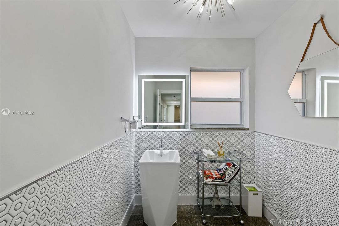 Perfect powder room half bath. No expense spared even in the smaller spaces.