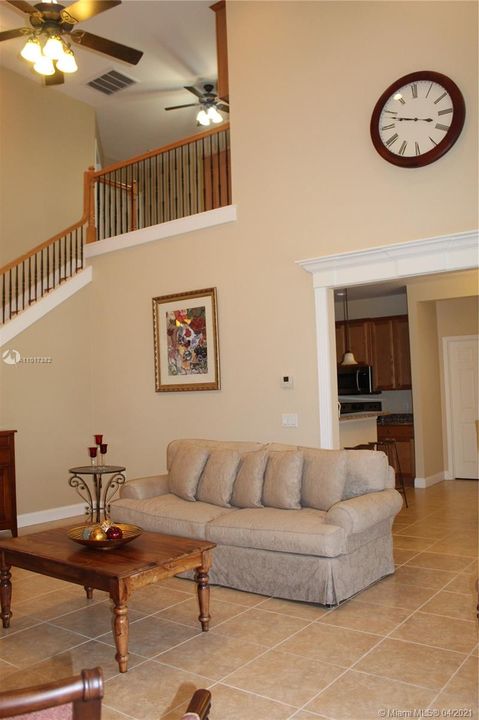 Living room overlooking the loft and leading to the kitchen area