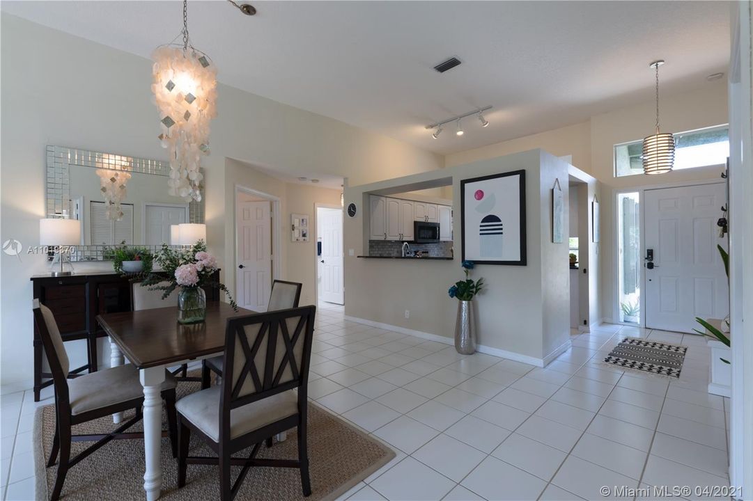 Dining-view of front door, kitchen, 2nd bed and guest bath