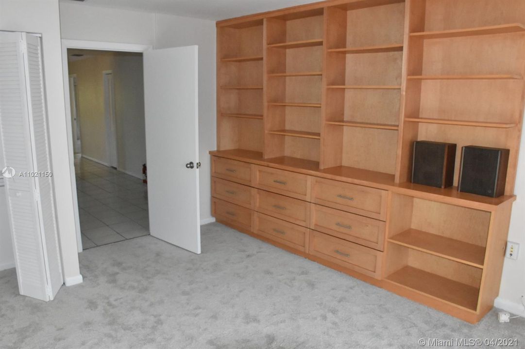 Bedroom with built-in cabinets
