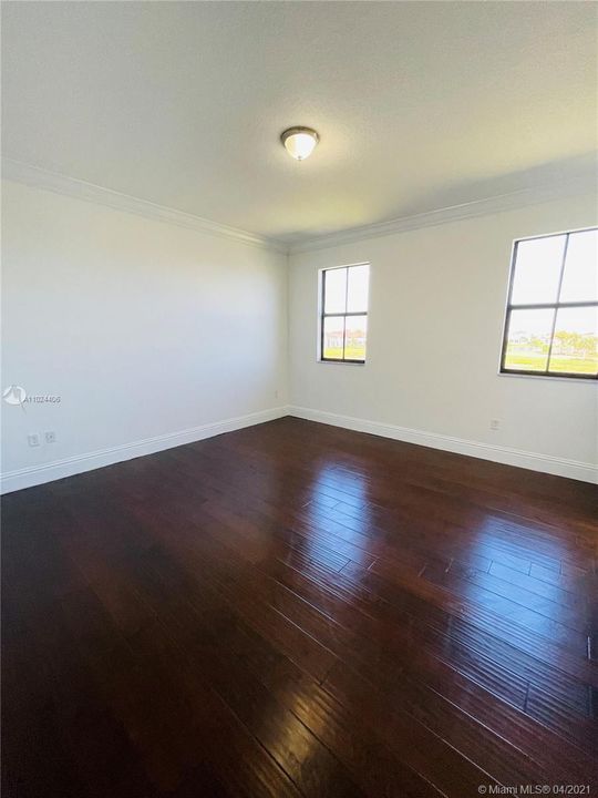 Bedroom with private bathroom and walk-in closet.