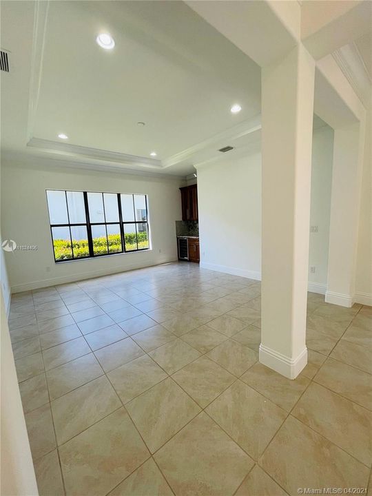 Formal Living Room includes crown molding, high hats, and wine cooler storage.