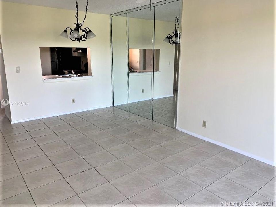 ROOMY LIVING/DINING ROOM AREA.