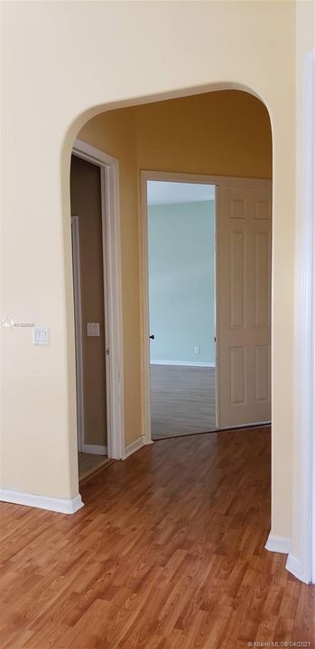 Way leading to the Half Bath and Entrance to the Master Bedroom