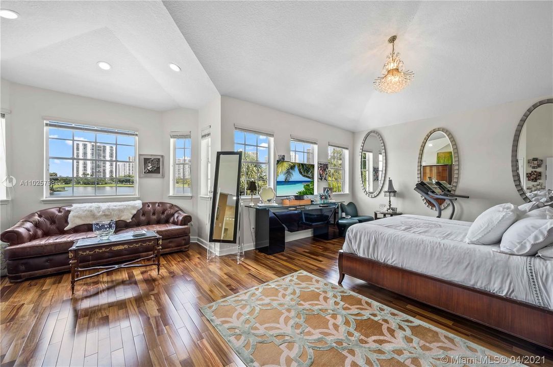 master bedroom with views of golf course and lake from every window!