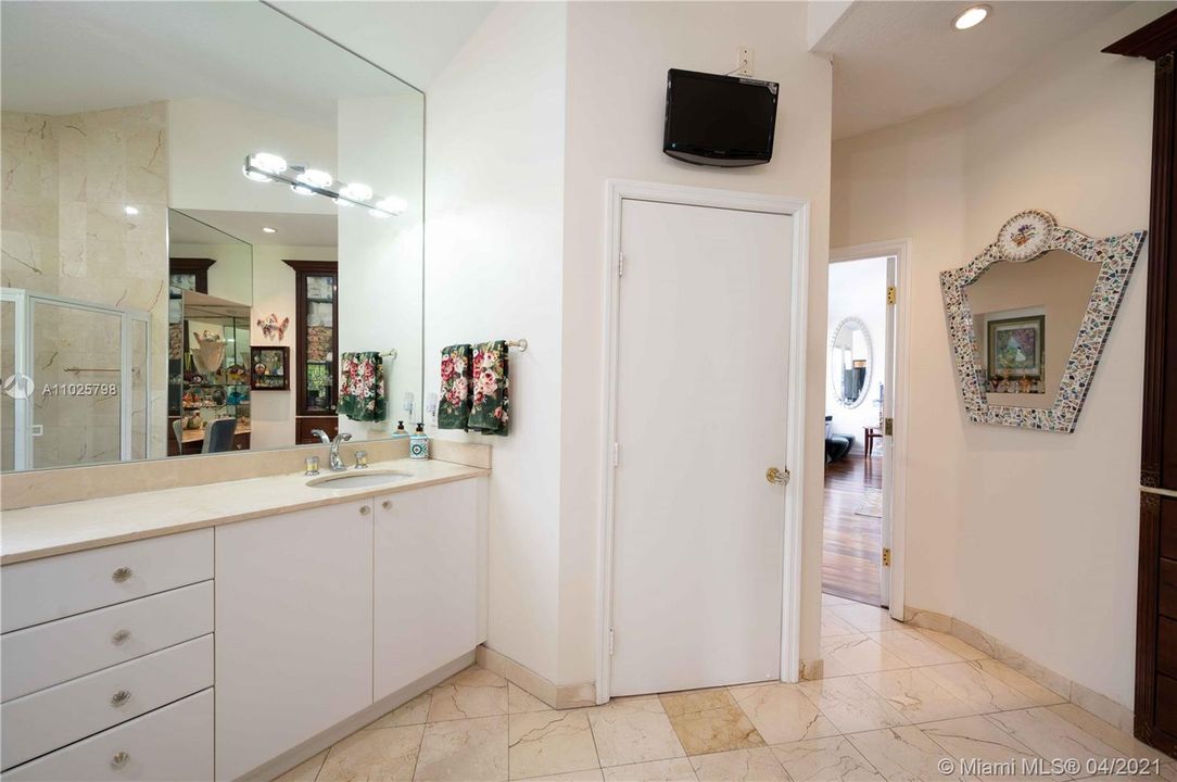 Master bathroom with private toilet area
