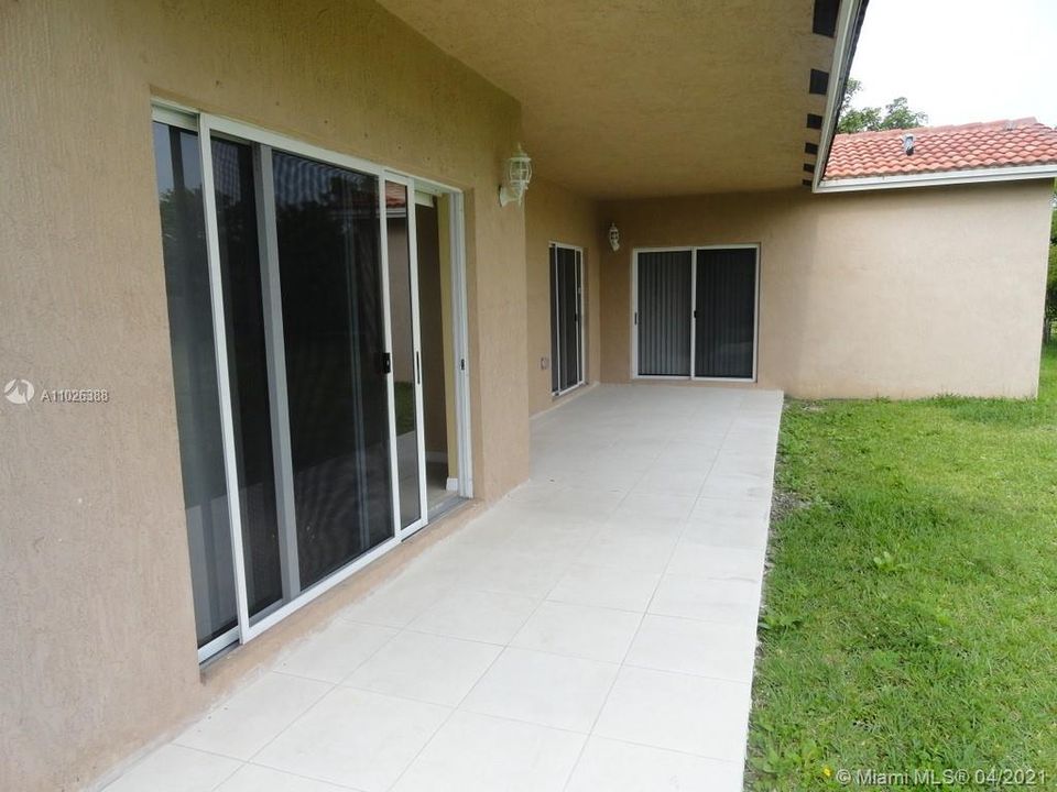 COVERED TERRACE -  ENTRANCE TO MASTER, DINING RM AND FAMILY ROOM