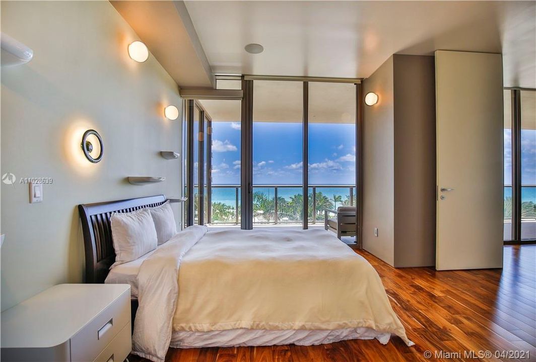 THIRD BEDROOM WITH OCEAN VIEWS AND SOPHISTICATED LIGHTING
