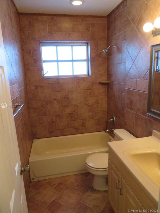 This very clean Bathroom is just outside the Middle Bedroom.