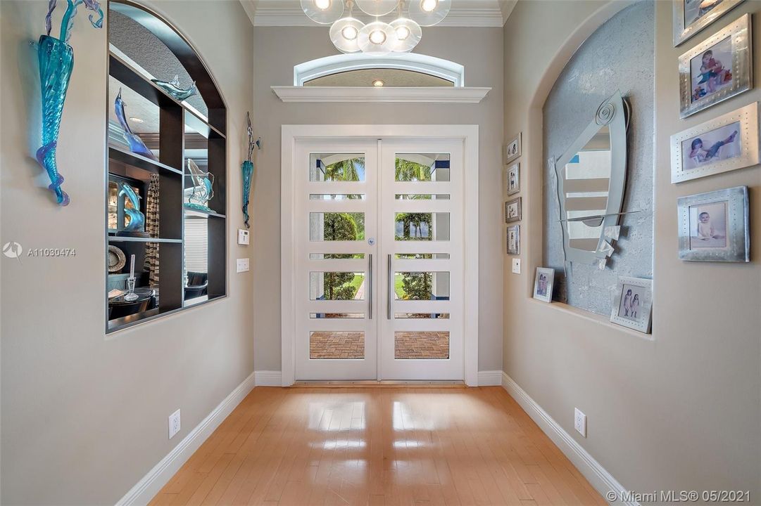 Foyer with new contemporary impact doors and hardware.