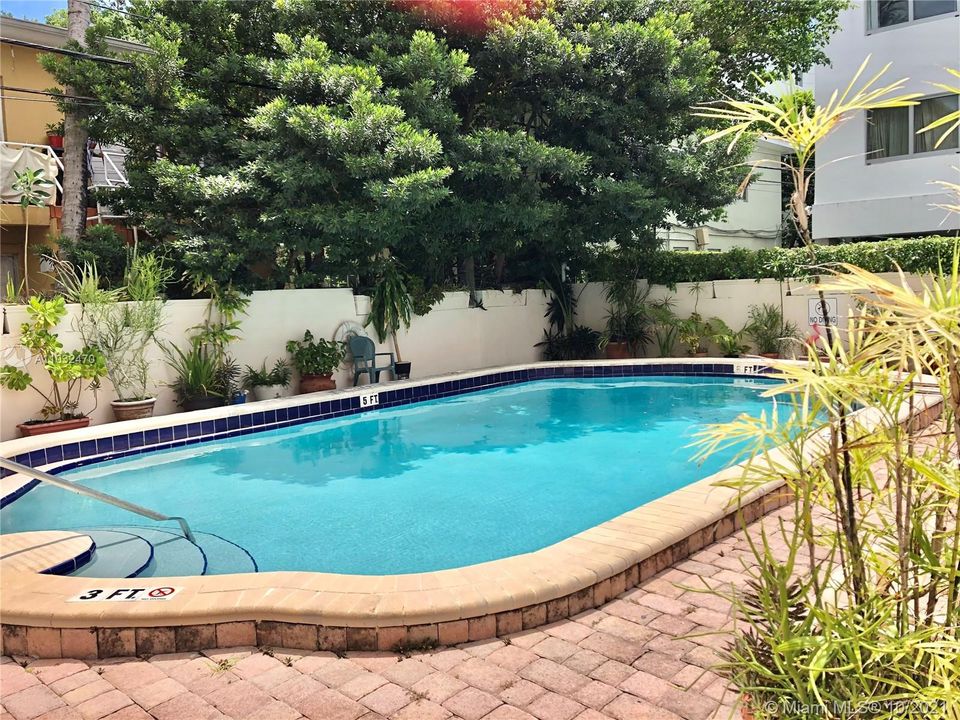 Pool from side showcasing plants