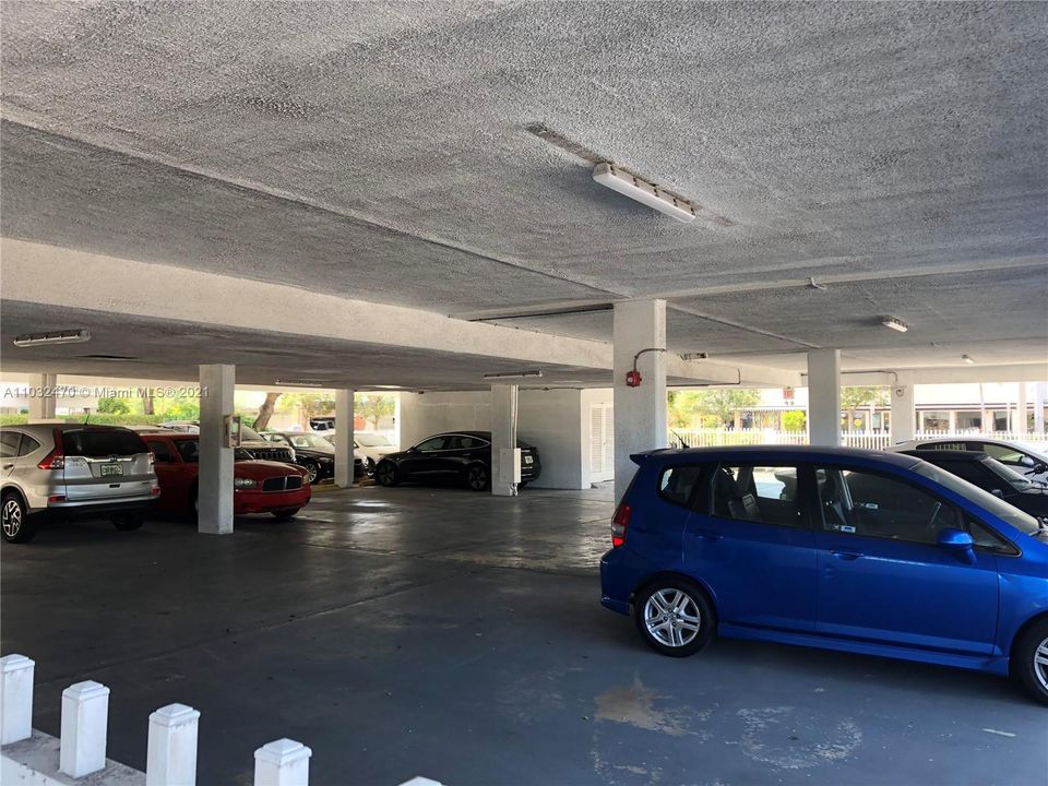 Building Parking Lot beneath Building; Most are covered spaces; Gated; Lights on timer.  One assigned parking space with unit.