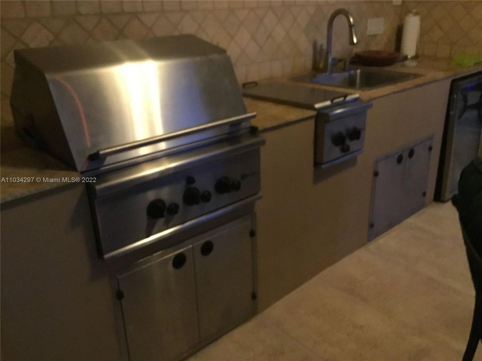 Patio outdoor in-lline gas Barbeque, cooking area, sink, Beverage refrigerator and storage