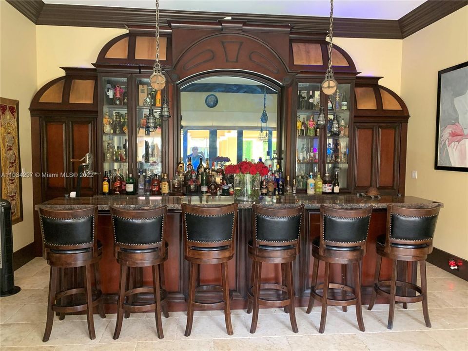 Cabana Bar with entry to back kitchen through side doors disguised as cabinets