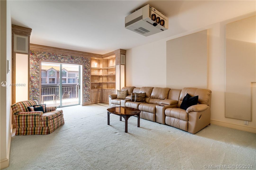 Downstairs media room with access to large balcony