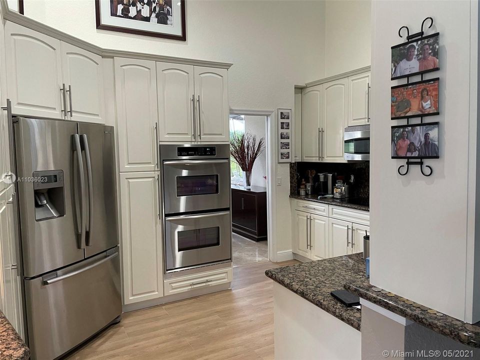 Beautiful Kitchen showing Ample Cupboard space, granite tops, double ovens and volume ceilings