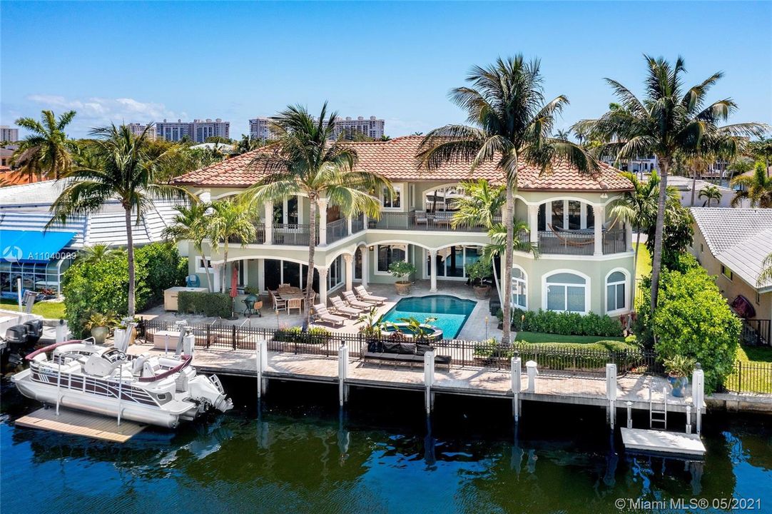 Enjoy your waterfront estate with 85' on the water sitting on a 140' wide canal, pavered dock & boat lift.