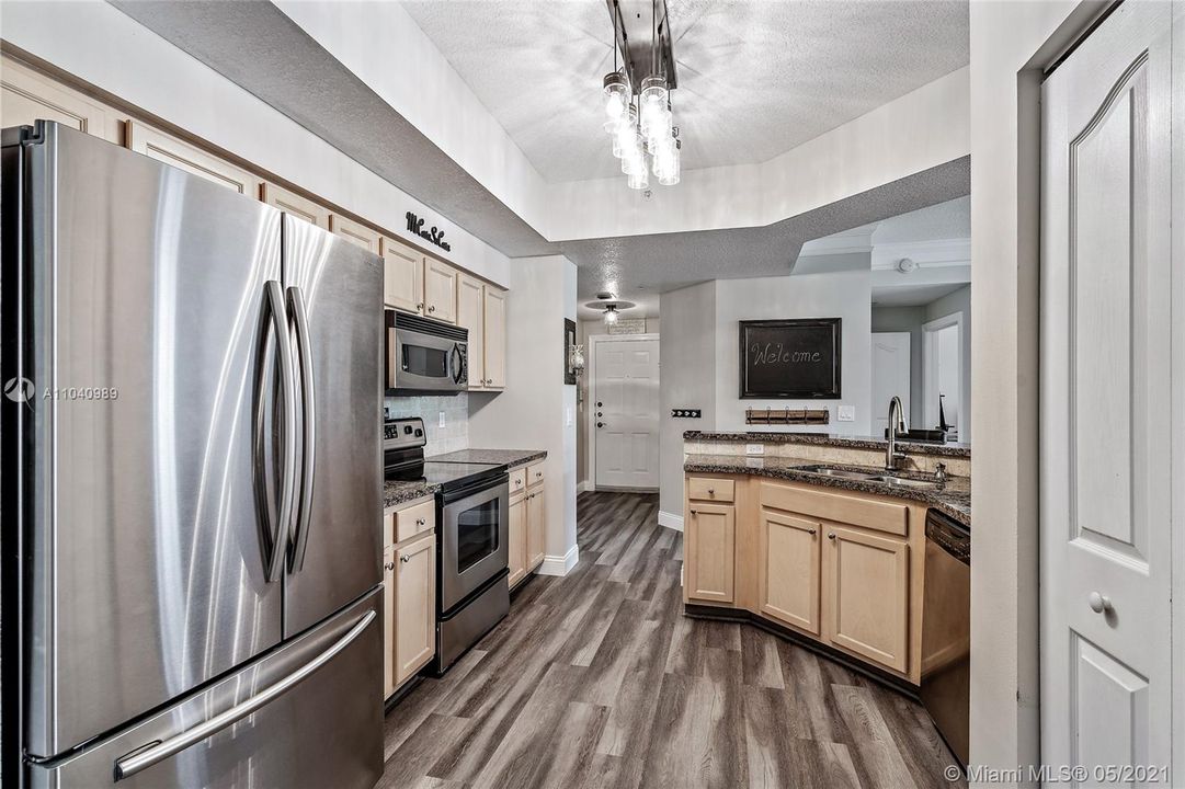 Front entry area, Kitchen with granite countertops and stainless steel appliances.