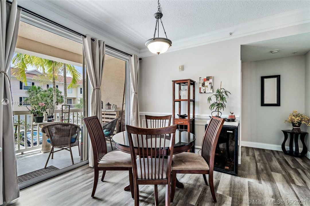 Dining room with sliders doors to balcony.