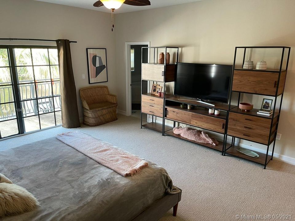 Another view of the main bedroom facing towards the door to the bathroom area.