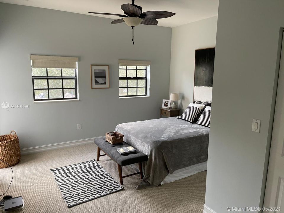 This bedroom has a balcony facing the front of the house and it's own ensuite bathroom.