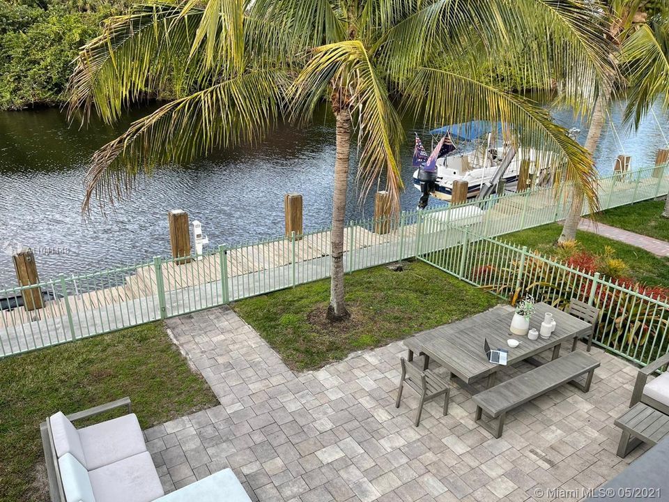 View of the patio from the master bedroom upstairs.