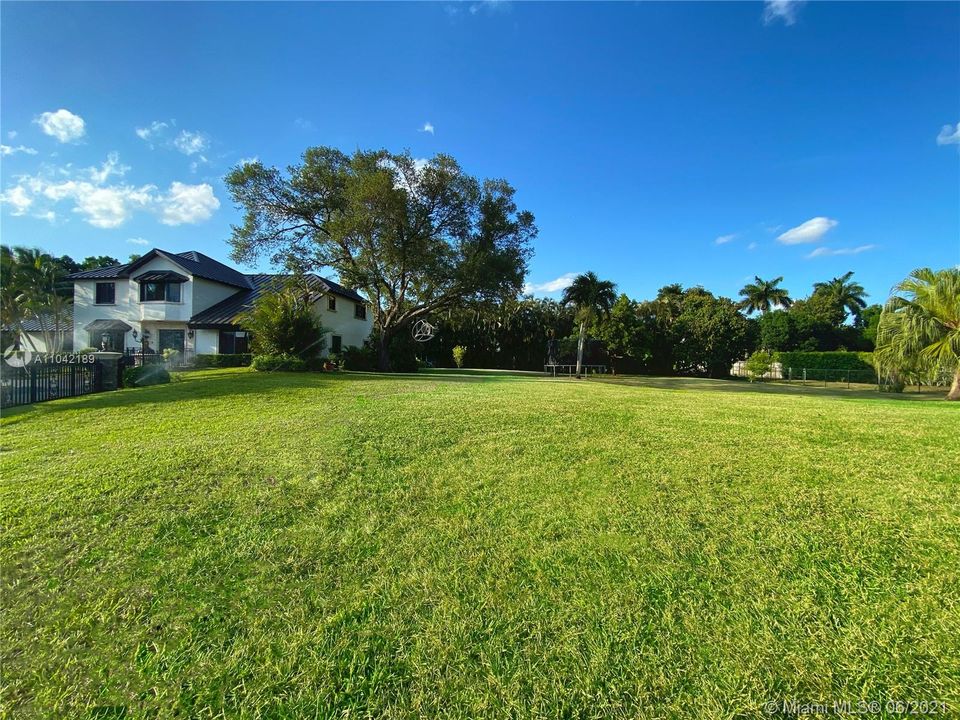 Open Area, Fenced throughout, fence goes deep into the ground in case a pet decides to dig in and go under.  Aluminum decorative Fence has a large opening.