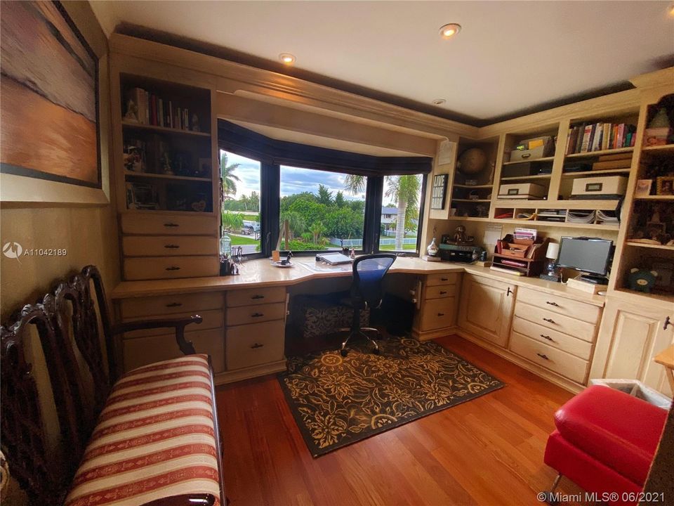 Bedroom #4.  This office was designed to maximize the space, lots of room, 100% antique wood, bay window faces the only island in Plantation Acres that is landscaped