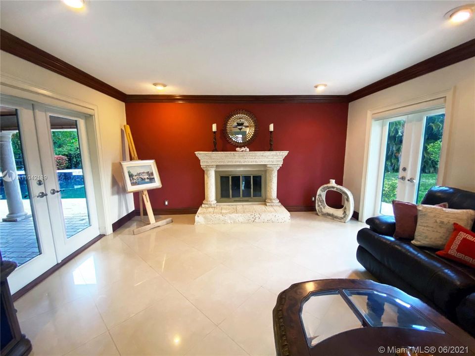 Living Area, Working Fireplace, travertine.  Doors are Double Pane impact doors, energy saver and high impact protection