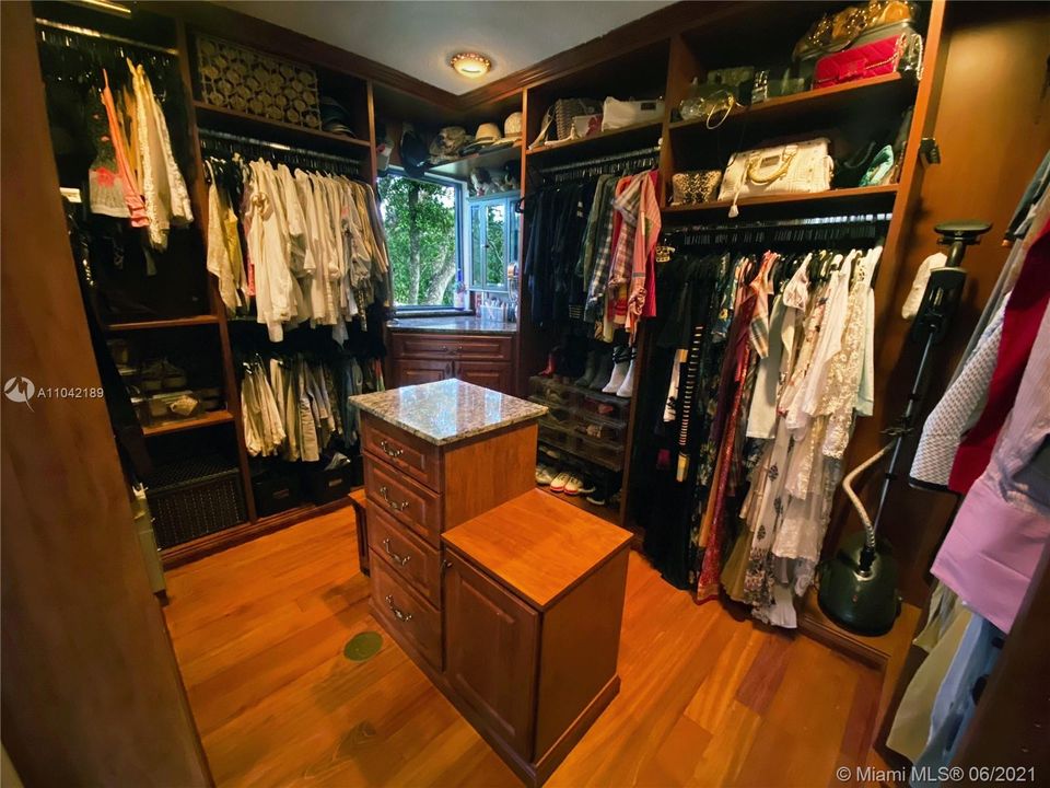 Walk in Closet with picture window, view to the North Side of Backyard