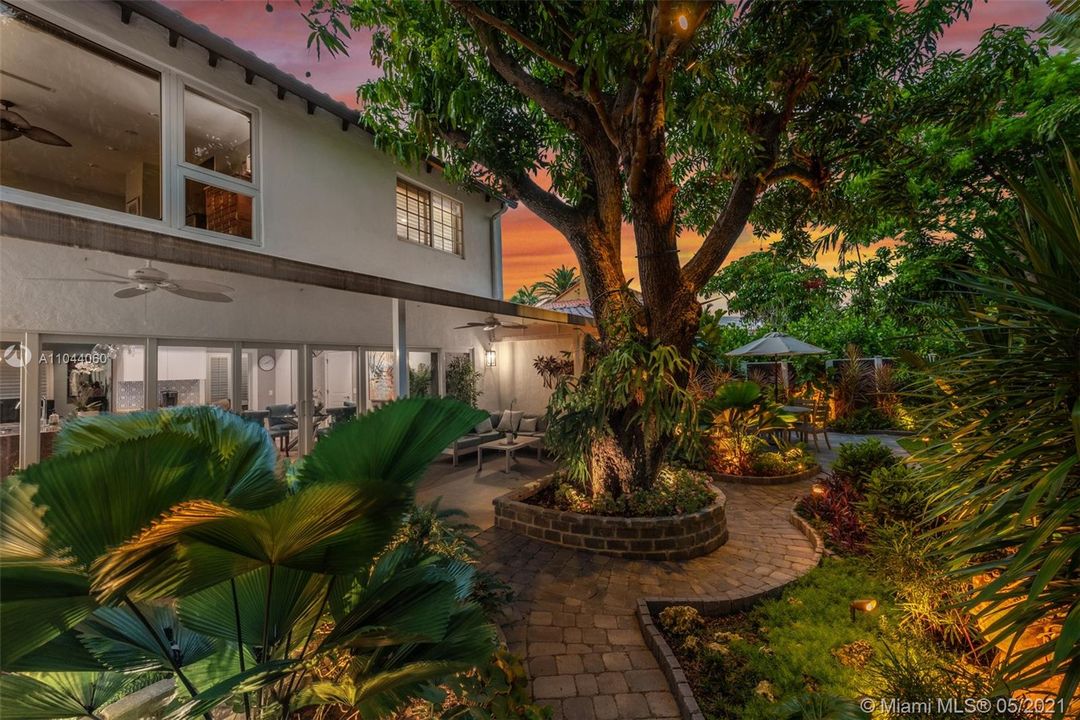 Extensive landscaping with privacy hedging and specimen palms, retaining walls and pathways that wind through the gardens. New sprinkler system with multiple zones.