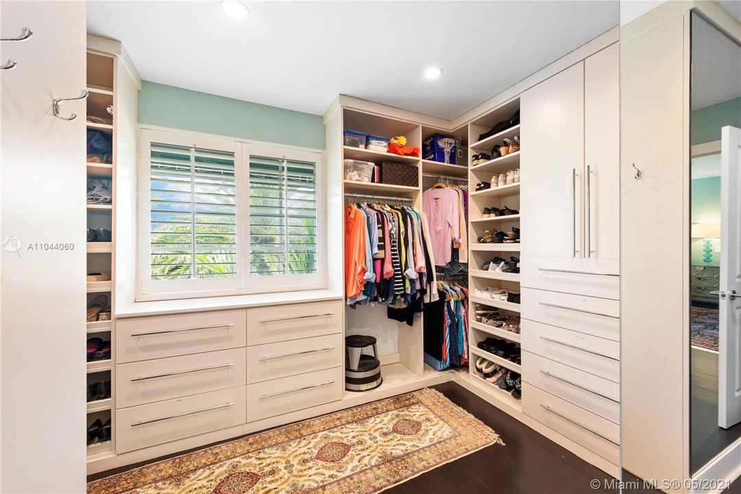 Multiple walk-in closets finished by The Closet Factory