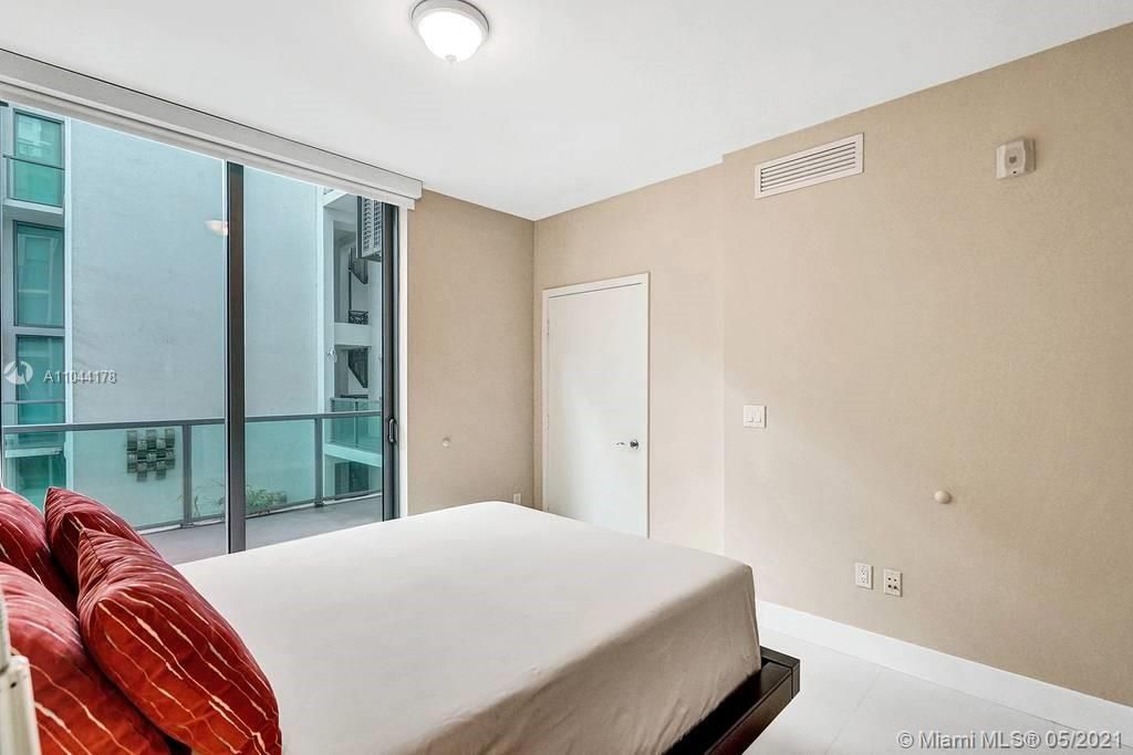 Standard size Bedroom with floor-to-ceiling windows