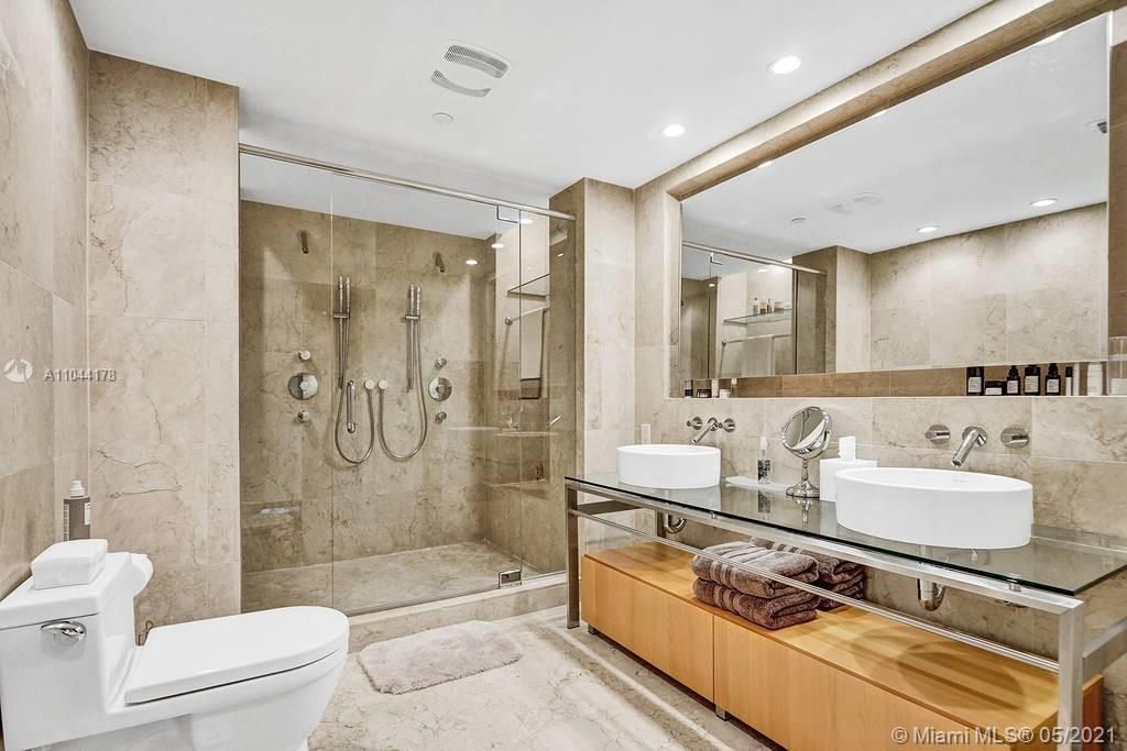Master bathroom with dual sink, dual shower and spray bidet, large walk-in closet