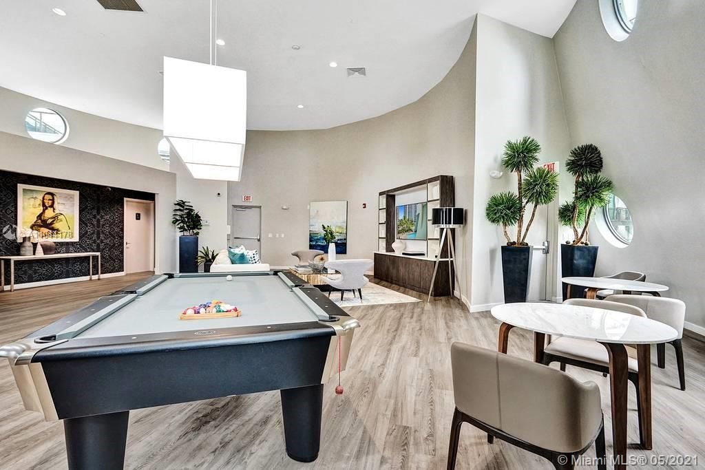 Beautifully-furnished Recreation Room with a pool table and nice seating area