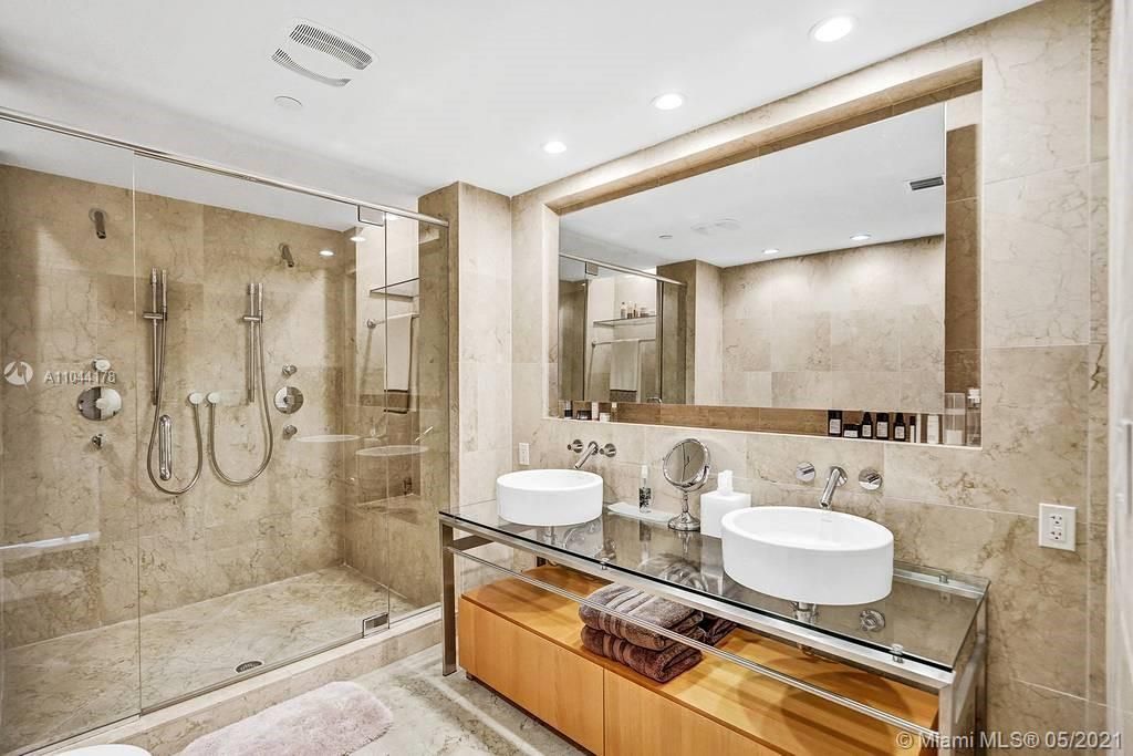 Gorgeous Master Bathroom w a dual sink and dual shower for Him & Her. Lots of storage space inside of the drawers,