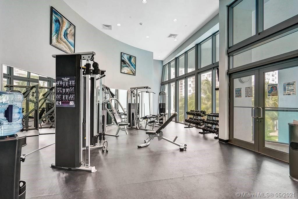 State-of-the-art Exercise Room w Floor-to-ceiling windows and maximum natural light
