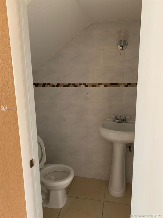 Half bath. Tile walls with decorative insert.