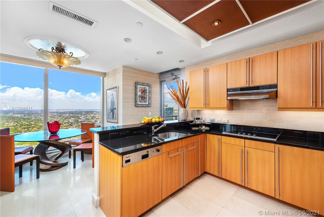 Well appointed kitchen with spacious breakfast area and beautiful panoramic views by day and night