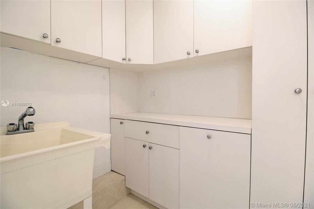 Laundry room with lots of cabinets.