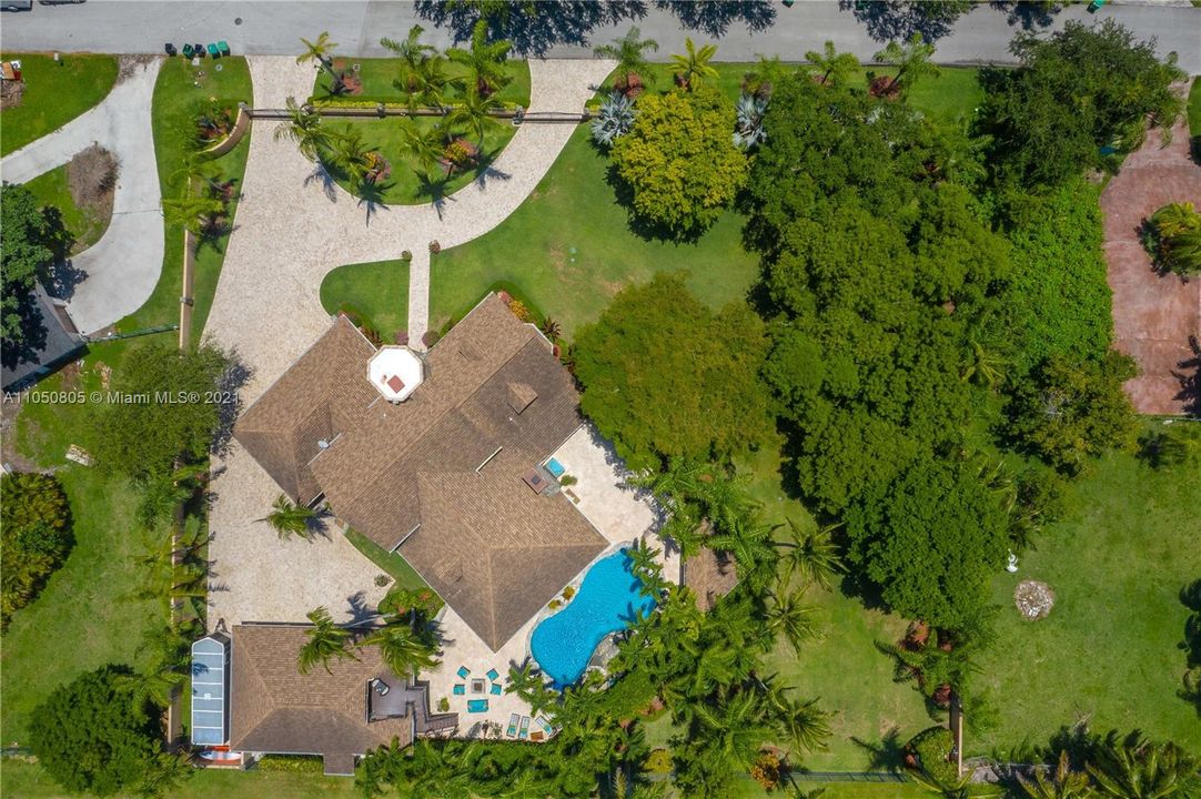 Aerial view of Main House, Detached 3 Car Garage and Pool Area
