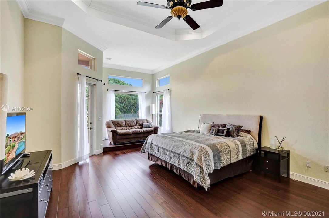 Casual and laid back Master Bedroom, with elegant bamboo floors and top to bottom windows and vaulted ceilings