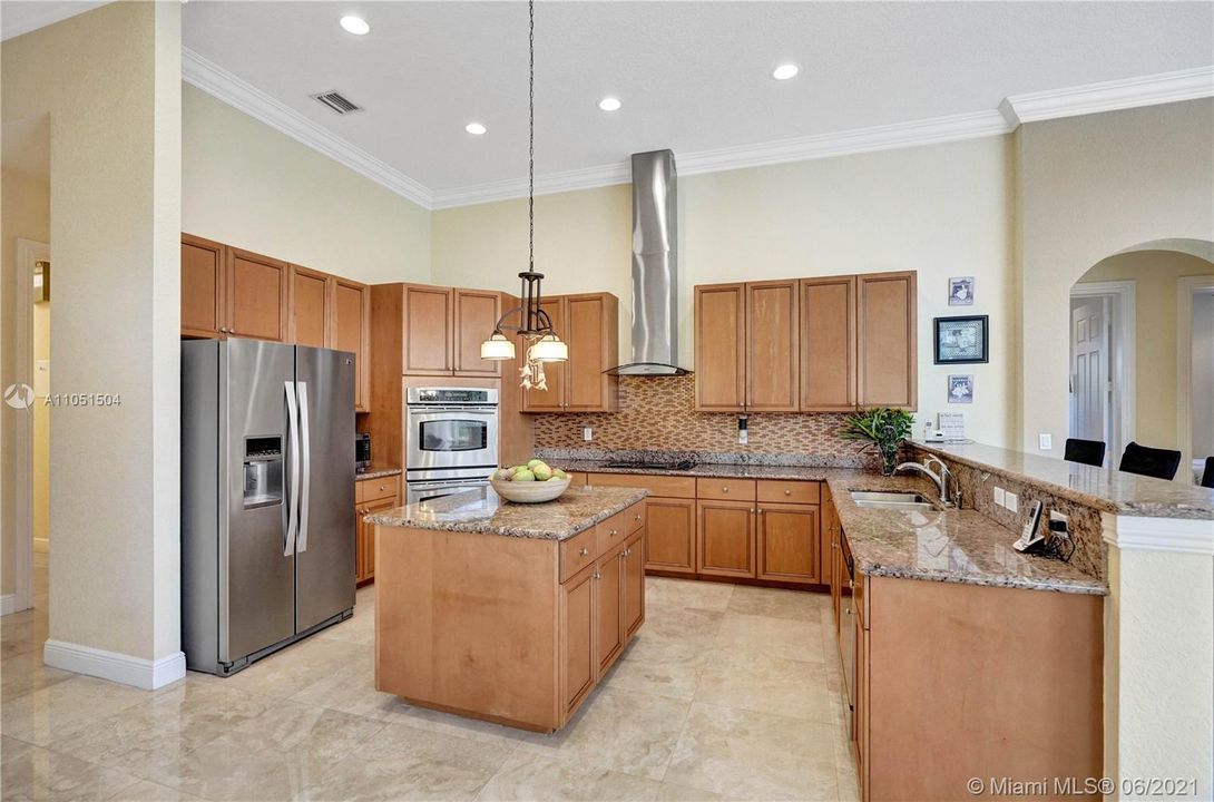 Fine gourmet kitchen with stainless steel appliances and hard wood cabinets