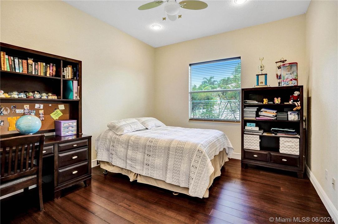 Guest bedroom with bamboo flooring