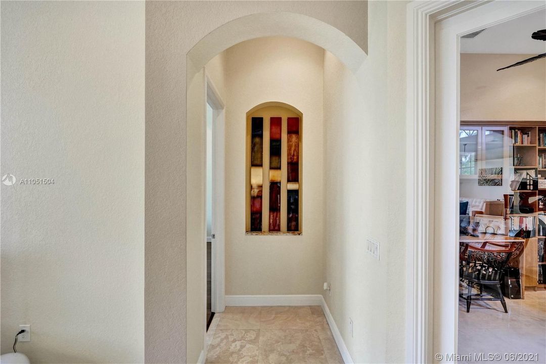 Wonderful arched hallway making the entrance to the master suite