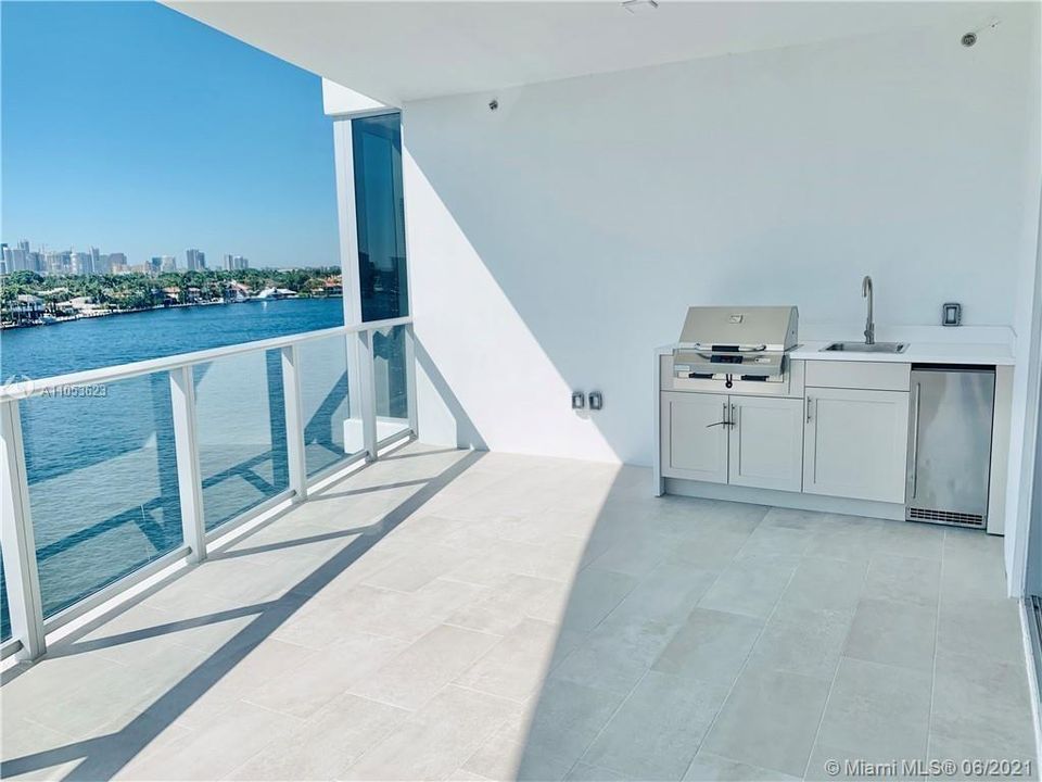 your private balcony with out door kitchen