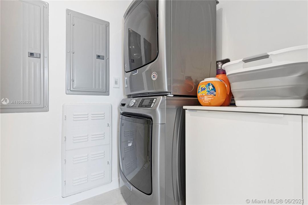 laundry with sink and cabinets across from machines (not shown)